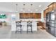 Modern kitchen with stainless steel appliances, white countertops, and pendant lighting at 4455 W Suncup Dr, San Tan Valley, AZ 85144