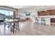 Open-concept living area featuring tile floors, dining area, and kitchen at 4455 W Suncup Dr, San Tan Valley, AZ 85144