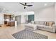 Bright living area with comfortable seating and views of the adjacent kitchen at 4455 W Suncup Dr, San Tan Valley, AZ 85144