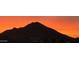 Incredible view of the nearby mountain against a vibrant orange sky, adding beauty to the home's location at 4455 W Suncup Dr, San Tan Valley, AZ 85144