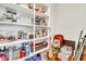 Pantry featuring white shelves for storing food, drinks, and paper goods at 4455 W Suncup Dr, San Tan Valley, AZ 85144