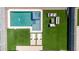 Aerial view of a backyard with a modern pool, spa, artificial turf, and outdoor seating area at 4455 W Suncup Dr, San Tan Valley, AZ 85144