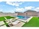 Relax by the pool with sun loungers in this backyard at 4455 W Suncup Dr, San Tan Valley, AZ 85144