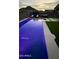 Backyard pool with artificial turf, lounge chairs, and mountain views for relaxing and entertaining at 4455 W Suncup Dr, San Tan Valley, AZ 85144