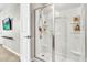 Modern bathroom featuring an enclosed shower with a silver shower head and plenty of shelving at 4455 W Suncup Dr, San Tan Valley, AZ 85144