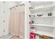 Walk-in shower with neutral tile and shelving at 4455 W Suncup Dr, San Tan Valley, AZ 85144