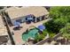 Aerial view of backyard with pool, patio, umbrellas, and outdoor seating at 4507 E Duane Ln, Cave Creek, AZ 85331