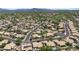 Expansive aerial view of a residential community nestled among lush golf courses and scenic mountain views at 4507 E Duane Ln, Cave Creek, AZ 85331