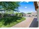Expansive backyard featuring lush green lawn, a sparkling pool, and serene landscaping for ultimate relaxation at 4507 E Duane Ln, Cave Creek, AZ 85331