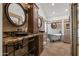 Elegant bathroom featuring dual vanities, a soaking tub, and a glass block shower at 4507 E Duane Ln, Cave Creek, AZ 85331