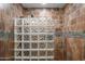 This bathroom shower features decorative tile walls and glass block for plenty of natural light at 4507 E Duane Ln, Cave Creek, AZ 85331