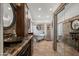 Spacious bathroom with dual sinks, soaking tub, glass block shower, and mirrored closet at 4507 E Duane Ln, Cave Creek, AZ 85331