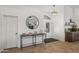 Bright foyer with modern chandelier, stylish console table, and decorative mirror, creating an inviting entry at 4507 E Duane Ln, Cave Creek, AZ 85331