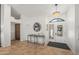 Bright foyer with modern chandelier, stylish console table, and decorative mirror, creating an inviting entry at 4507 E Duane Ln, Cave Creek, AZ 85331