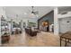 Cozy living room with a ceiling fan, plush leather sofa, and view of the backyard, creating a relaxing atmosphere at 4507 E Duane Ln, Cave Creek, AZ 85331