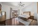 Bright main bedroom with hardwood floors and sliding glass doors leading to an outdoor pool and patio area at 4507 E Duane Ln, Cave Creek, AZ 85331