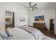 Spacious main bedroom with a large bed, hardwood floors, TV, ensuite bathroom, and ample closet space at 4507 E Duane Ln, Cave Creek, AZ 85331