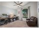 Bright home office with built in desks and large windows, promoting a productive and pleasant workspace at 4507 E Duane Ln, Cave Creek, AZ 85331