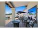 Covered patio with comfortable seating, overlooking the pool and beautifully landscaped backyard at 4507 E Duane Ln, Cave Creek, AZ 85331