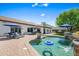Inviting backyard pool with waterfall feature and lounge seating, perfect for relaxation and outdoor entertaining at 4507 E Duane Ln, Cave Creek, AZ 85331