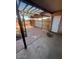 Cozy back patio featuring a pergola, brick flooring, and a wooden fence for added privacy and charm at 4625 W Thomas Rd # 48, Phoenix, AZ 85031