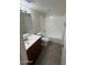 Clean bathroom featuring a vanity sink, toilet, and a tub-shower combination at 4625 W Thomas Rd # 48, Phoenix, AZ 85031