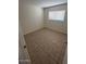 A bedroom with neutral decor, and tile flooring at 4625 W Thomas Rd # 48, Phoenix, AZ 85031