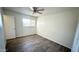 Cozy bedroom featuring laminate wood flooring and natural light at 4625 W Thomas Rd # 48, Phoenix, AZ 85031