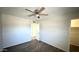 A bright bedroom features wood-look floors and a ceiling fan at 4625 W Thomas Rd # 48, Phoenix, AZ 85031