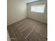 Bright bedroom featuring tiled floor and a window with natural light at 4625 W Thomas Rd # 48, Phoenix, AZ 85031