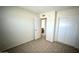 Neutral bedroom features tile flooring and closet with sliding doors at 4625 W Thomas Rd # 48, Phoenix, AZ 85031