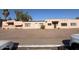 Modest, single-story residential building with stucco facade and gravel landscaping at 4625 W Thomas Rd # 48, Phoenix, AZ 85031