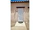 Villa Alegre Condominiums unit with white sunburst security door and tile entry at 4625 W Thomas Rd # 48, Phoenix, AZ 85031
