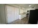 Efficient kitchen with stainless steel appliances and laminate wood flooring at 4625 W Thomas Rd # 48, Phoenix, AZ 85031
