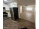 An open-concept kitchen has stainless steel appliances and bar seating at 4625 W Thomas Rd # 48, Phoenix, AZ 85031