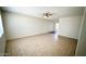 Spacious living room with tile flooring and a ceiling fan, creating a comfortable and inviting space at 4625 W Thomas Rd # 48, Phoenix, AZ 85031