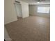Open-concept living room with great natural light and tile floors at 4625 W Thomas Rd # 48, Phoenix, AZ 85031