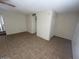 A view of the living room featuring neutral decor and tile floors at 4625 W Thomas Rd # 48, Phoenix, AZ 85031