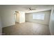 Inviting living area with tile flooring, ceiling fan, and a large window, offering a bright and airy atmosphere at 4625 W Thomas Rd # 48, Phoenix, AZ 85031