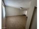 A living room with tile flooring, ceiling fan, and large window at 4625 W Thomas Rd # 48, Phoenix, AZ 85031