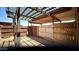 Covered patio area with wood pergola and partial fencing at 4625 W Thomas Rd # 48, Phoenix, AZ 85031