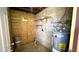 A utility room features a water heater and shelving at 4625 W Thomas Rd # 48, Phoenix, AZ 85031
