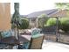 Serene backyard with a patio table, chairs, umbrella, and swing; perfect for outdoor relaxation at 4778 E Sourwood Dr, Gilbert, AZ 85298