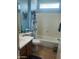 Traditional bathroom featuring a shower-tub combo with a patterned curtain and single sink vanity at 4778 E Sourwood Dr, Gilbert, AZ 85298