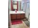Well-lit bathroom featuring a double sink vanity and glass-enclosed shower at 4778 E Sourwood Dr, Gilbert, AZ 85298