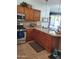 A cozy kitchen features wood cabinets, stainless steel appliances, and an eating area at 4778 E Sourwood Dr, Gilbert, AZ 85298