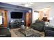 Inviting living room with comfortable seating, entertainment center, and stylish decor at 4778 E Sourwood Dr, Gilbert, AZ 85298