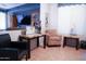 Comfortable sitting area featuring tile floors, ample windows, and stylish furnishings at 4778 E Sourwood Dr, Gilbert, AZ 85298