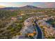 Panoramic aerial view highlighting community with winding streets, desert landscaping, and mountain views at 5100 E Rancho Paloma Dr # 1044, Cave Creek, AZ 85331
