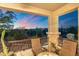 Enjoy desert views from this charming balcony with cushioned chairs and a small table, perfect for relaxing at 5100 E Rancho Paloma Dr # 1044, Cave Creek, AZ 85331